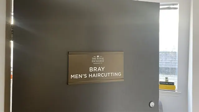 The Bray Men's Haircutting sign in the Royal Exchange