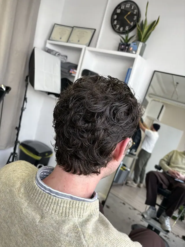 A curly cut, from behind